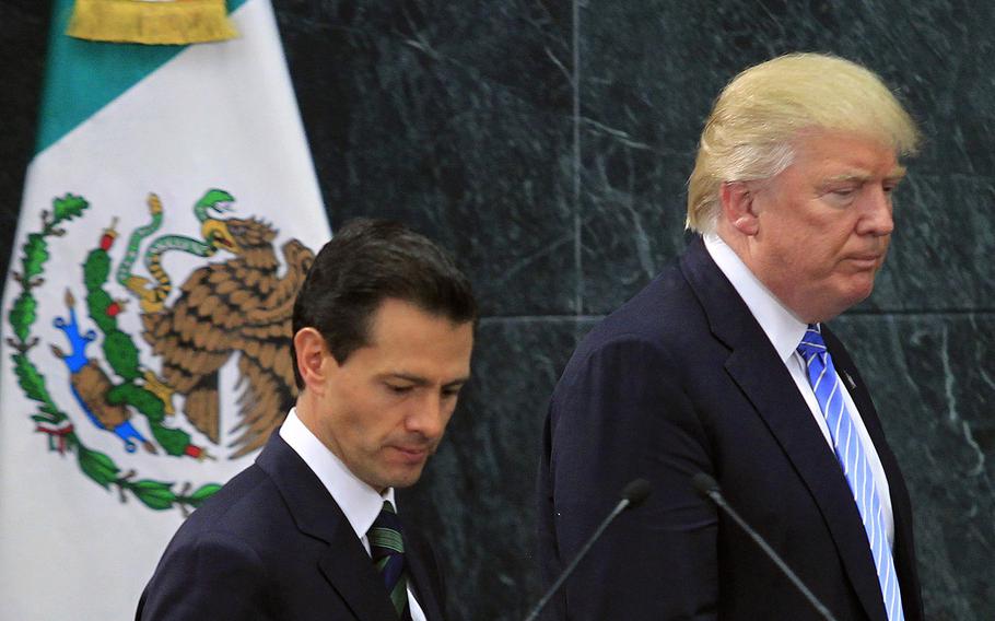 President-elect Donald Trump, right, is seen at a joint press conference with Mexican President Enrique Pena Nieto after their Aug. 31, 2016 meeting in Mexico City, Mexico. 