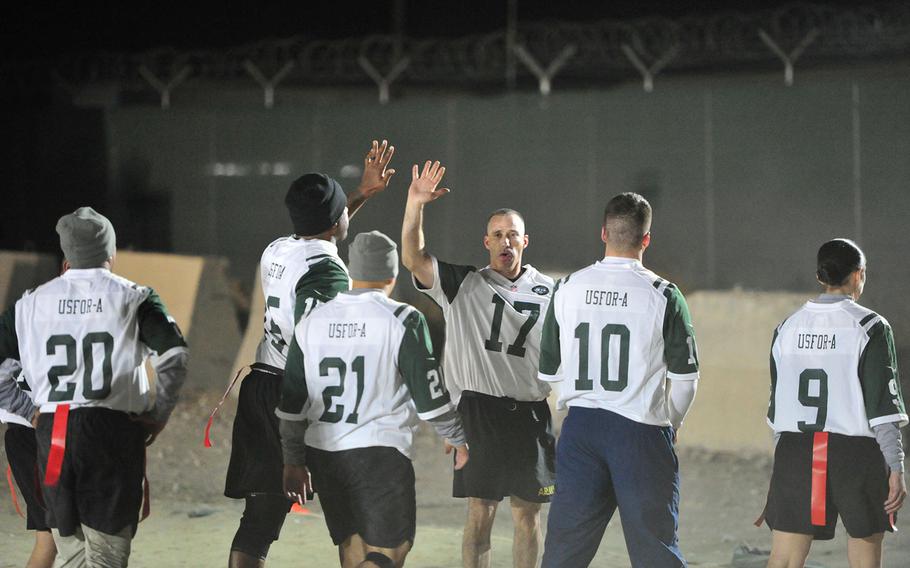The military service members of U.S. Forces Afghanistan begin their 2016 Thanksgiving celebration with a Turkey Bowl football game at Bagram Airfield, Nov. 23, 2016.