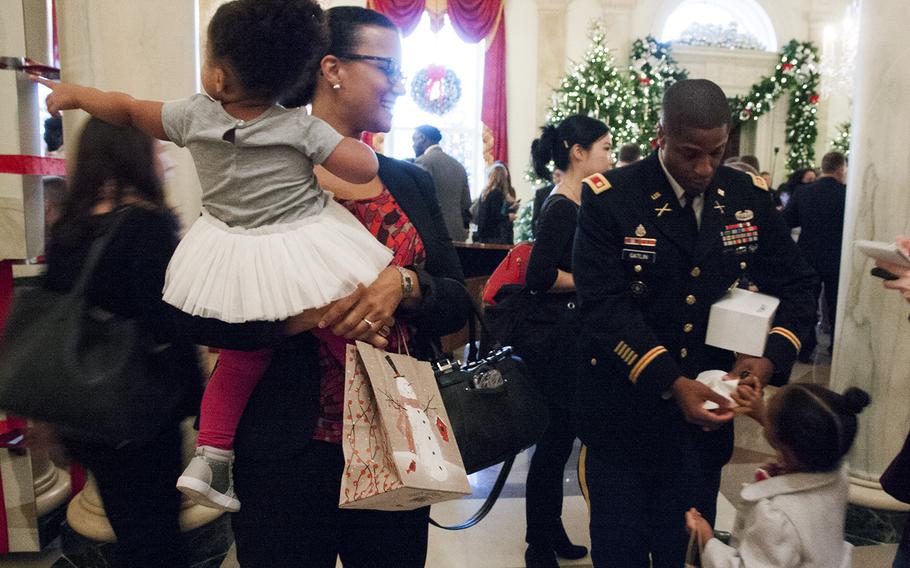 Army Lt. Col. Tim Gatlin (right), his wife, Jeanine, and daughters Ella and Brayden during a visit to the White House on Nov. 29, 2016. First Lady Michelle Obama welcomed military families to the White House to preview this year's holiday decorations.