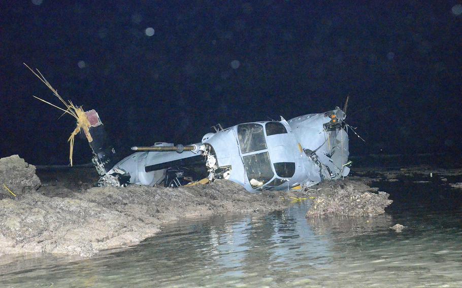 The wreckage of an MV-22 Osprey is seen in shallow waters off Nago, Okinawa, on Wednesday, Dec. 14, 2016. The aircraft crash-landed Tuesday after a rotor sliced a fuel line from a C-130 during a nighttime aerial refueling training event.