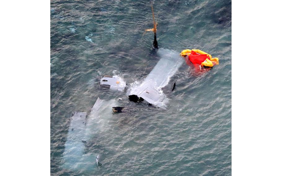 Debris from the wreckage of an MV-22 Osprey is seen in shallow waters off Nago, Okinawa, on Wednesday, Dec. 14, 2016. The aircraft crash-landed Tuesday after a rotor sliced a fuel line from a C-130 during a nighttime aerial refueling training event.