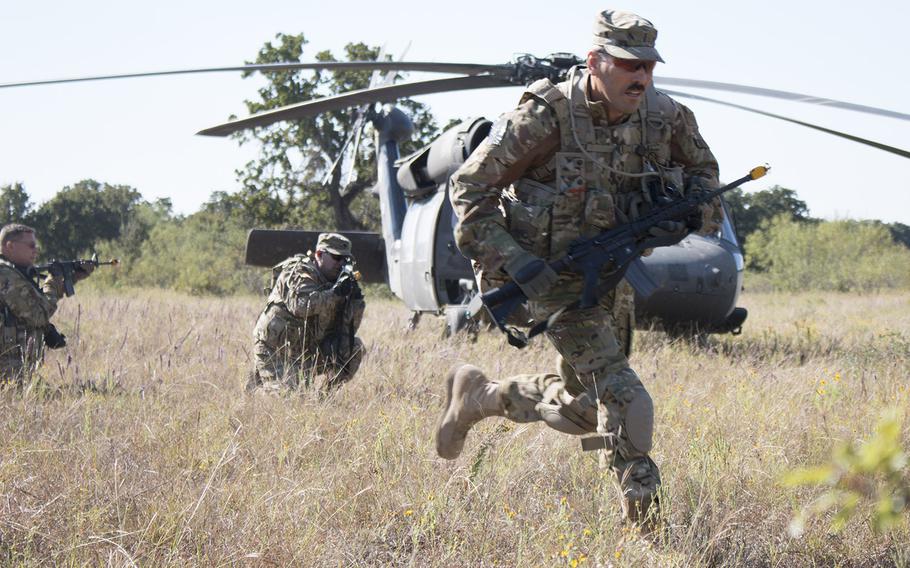 In an October, 2015 file photo, soldiers from the California Army National Guard's 40th Combat Aviation Brigade hit the ground running during a small unit tactics exercise at Fort Hood, Texas.