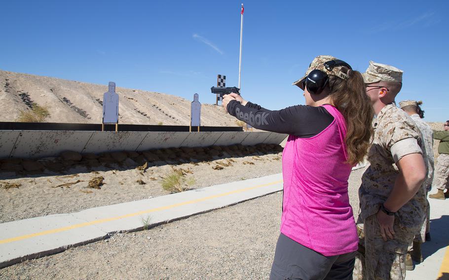 Jamie Teale takes aim during a shooting competition held at the pistol range at Marine Corps Logistics Base Barstow, Calif., Oct. 14, 2016. Legislation introduced Thursday would make it easier for military spouses to purchase guns wherever their active-duty husband or wife is stationed.