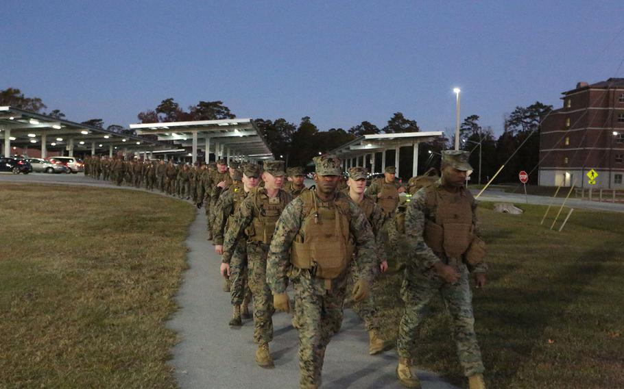 Marines commence a 7-mile conditioning hike at Camp Lejeune, N.C. on Nov. 22, 2016. 