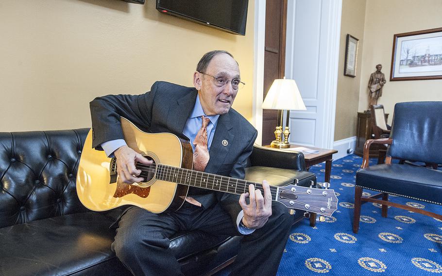 After giving an interview with Stars and Stripes reporter Nikki Wentling, Rep. Phil Roe, R-Tenn., the newly designated chairman of the House Committee on Veterans' Affiairs, plays a tune on a guitar he keeps on hand in his office on Capitol Hill in Washington, D.C., on Thursday, Jan. 12, 2017.