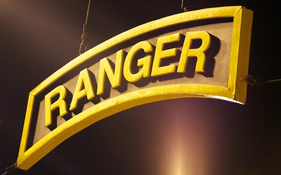 A sign in the shape of the U.S. Army Ranger tab hangs above the training area at Fort Benning, Ga., in April, 2014.