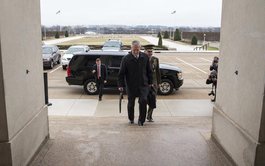 Secretary of Defense James Mattis greets U.S. Marine Corps Gen. Joseph Dunford, Chairman of the Joint Chiefs of Staff, after arriving at the Pentagon in Washington, D.C., Jan. 21, 2017.  