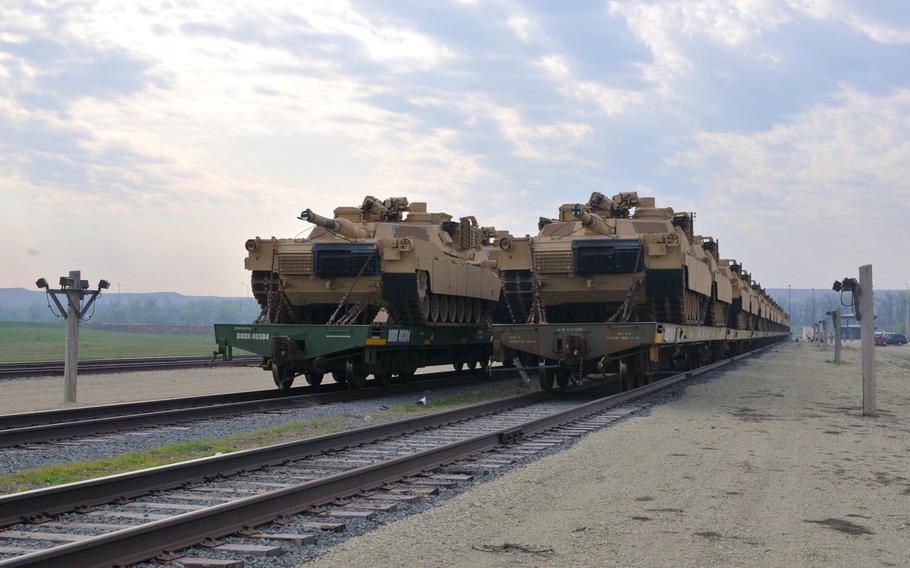 Several dozen of the Army's "newest" Abrams tanks wait to be offloaded from flatbed train cars in 2012 at Fort Riley's Railhead. A recent Congressional Research Service report said the automatic-loading 125-mm guns on the Chinese MBT-3000 and the Russian T-14 Armata could “theoretically offer greater range and armor penetration" than the American 120-mm.