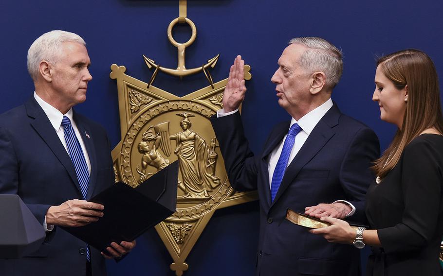 Defense Secretary Jim Mattis is sworn in by Vice President Mike Pence in a ceremony Friday in the Pentagon's Hall of Heroes. Mattis, a retired Marine general, was confirmed Jan. 20 by the Senate to serve as the nation's 26th Pentagon chief.