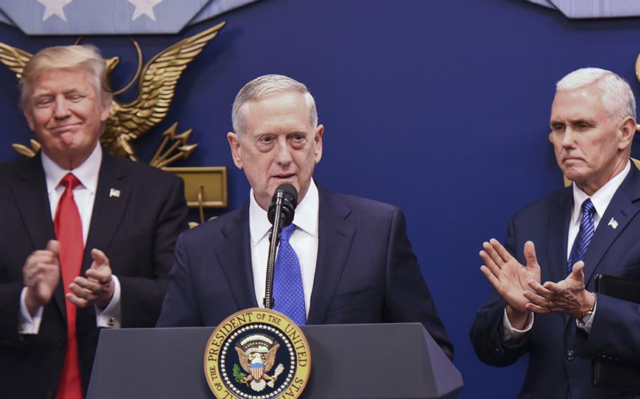 Defense Secretary Jim Mattis speaks after his ceremonial swearing-in Friday at the Pentagon. President Donald Trump and Mike Pence look on.