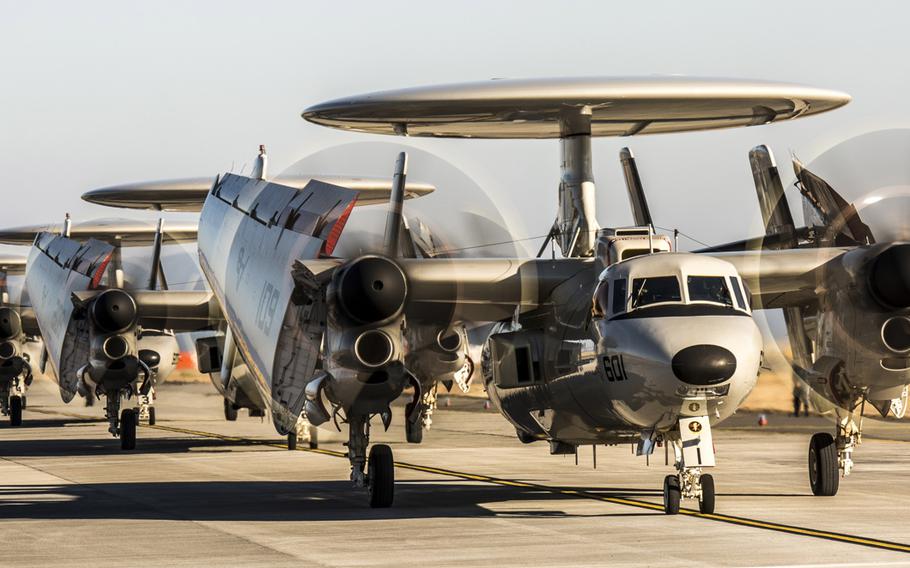 Five U.S. Navy E-2D Advanced Hawkeyes with Carrier Airborne Early Warning Squadron 125 land at Marine Corps Air Station Iwakuni, Japan, Thursday, Feb. 2, 2017. 