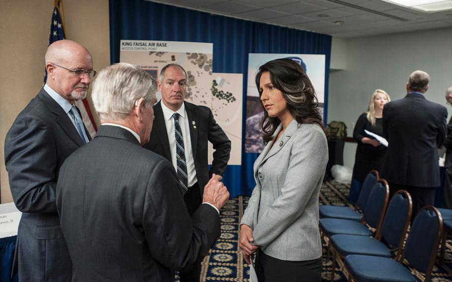 Congresswoman Tulsi Gabbard, D-Hawaii, attends a National Press Club event in Washington, D.C., on  Tuesday, March 7, 2017, as the fathers of three Green Berets killed in Jordan on Nov. 4, 2016, give details of how their sons were killed. Clockwise from Gabbard's left are, James Moriarty, Sr., father of Staff Sgt. James Moriarty; Brian McEnroe, father of Staff Sgt. Kevin McEnroe; and Chuck Lewellen, father of Sgt. 1st Class Matthew Lewellen.