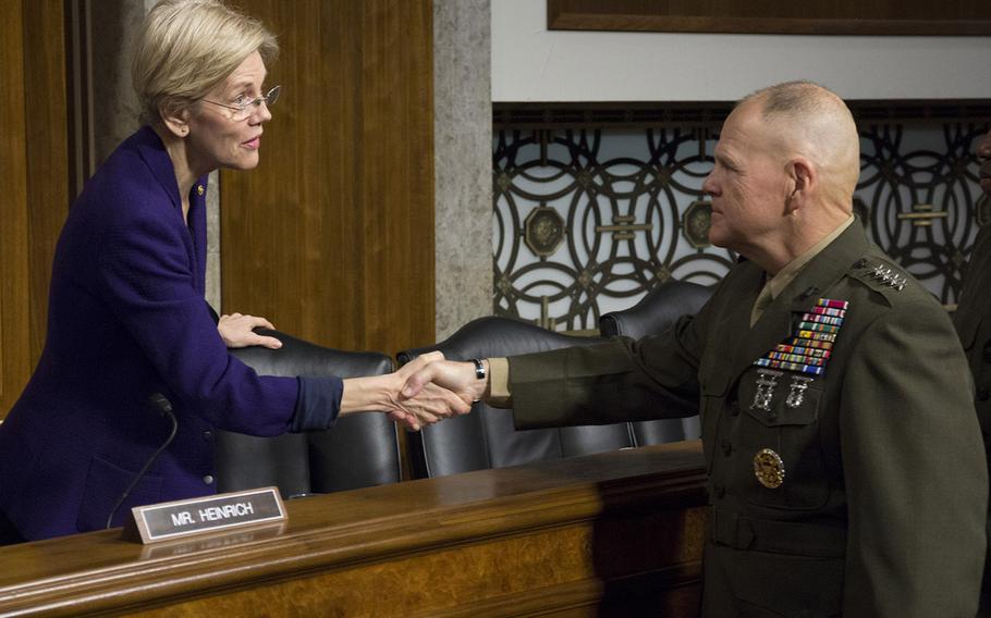 Marine Corps Commandant Gen. Robert B. Nellershakes hands with Sen. Elizabeth Warren, D-Mass., before a Senate Armed Services Committee hearing on the Marines United social media controversy, March 14, 2017 on Capitol Hill.