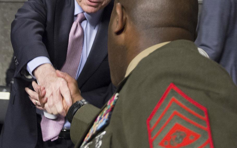 Senate Armed Services Committee Chairman John McCain, R-Ariz., shakes hands with Sergeant Major of the Marine Corps Ronald L. Green before a  hearing on the Marines United social media controversy, March 14, 2017 on Capitol Hill.
