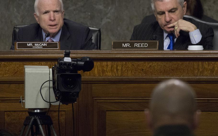 Senate Armed Services Committee Chairman John McCain, R-Ariz., questions Marine Corps Commandant Gen. Robert B. Neller, foreground, during a hearing on the Marines United social media controversy, March 14, 2017 on Capitol Hill. At right is Ranking Member Jack Reed, D-R.I.