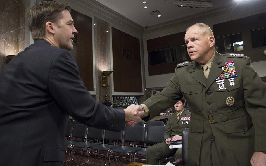 Marine Corps Commandant Gen. Robert B. Neller shakes hands with Sen.Ben Sasse, R-Neb., before a Senate Armed Services Committee hearing on the Marines United social media controversy, March 14, 2017 on Capitol Hill.