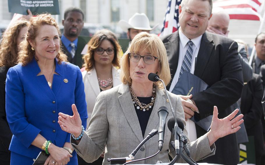 Sen. Maggie Hassan, D-N.H., speaks at a Capitol Hill press conference on March 21, 2017. Behind her are Rep. Elizabeth Esty, D-Conn., left, and Sen. Jon Tester, D-Mont., right.