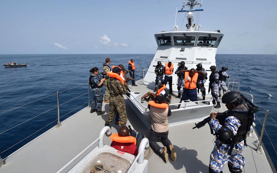 The Ivorian Maritime Interdiction Operations team conduct a simulated anti-narcotics search-and-seizure raid on March 27, 2017, near Cote d'Ivoire during the Obangame Express exercise. 