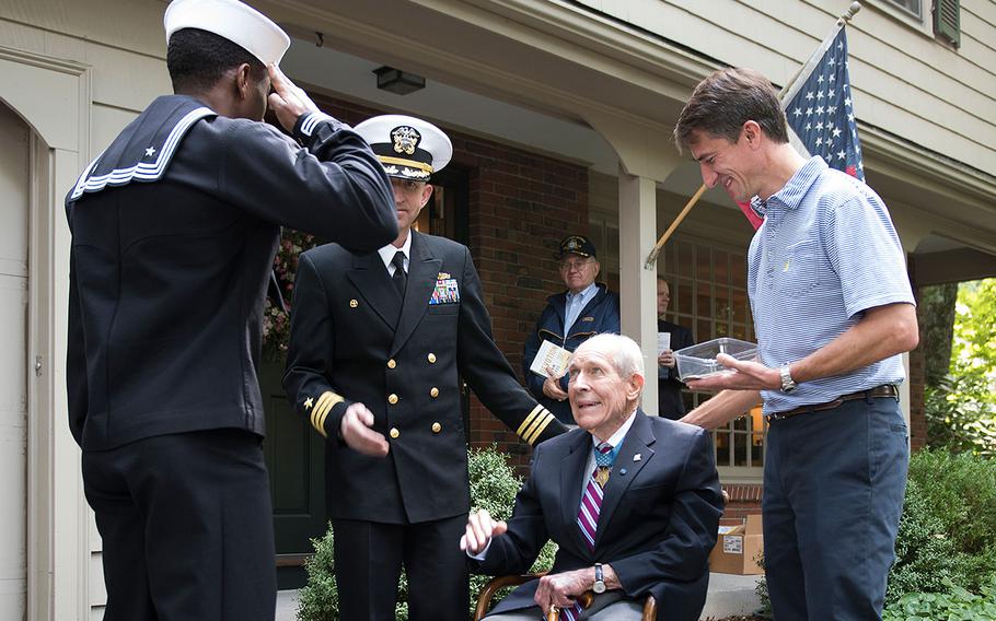 A sailor assigned to Pre-Commissioning Unit Thomas Hudner (DDG 116) salutes Capt. (Ret.) Thomas Hudner on Sept. 24, 2016 in Concord, Massachusetts during a visit with the ship’s namesake. Hudner is a naval aviator who was awarded the Medal of Honor on April 13, 1951 for displaying conspicuous gallantry and intrepidity at the risk of his life during the Battle of Chosin Reservoir during the Korean War.