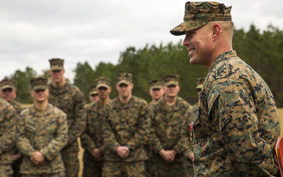U.S. Marine Staff Sgt. Nathan A. Hervey speaks at Marine Corps Base Camp Lejeune, N.C., Feb. 5, 2016. Hervey was awarded the Bronze Star Medal with the combat distinguishing device for valor. New regulations will see the authorization of "C" and "R" devices to be added to some awards. 