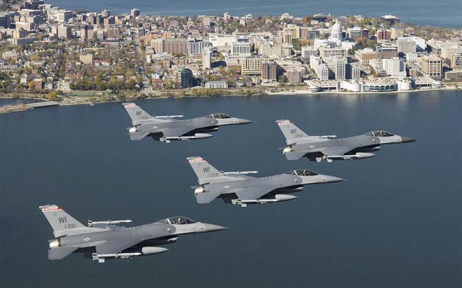 Four F-16C Fighting Falcons from the Wisconsin Air National Guard fly over the capital city of Madison, Wis., in 2008. 