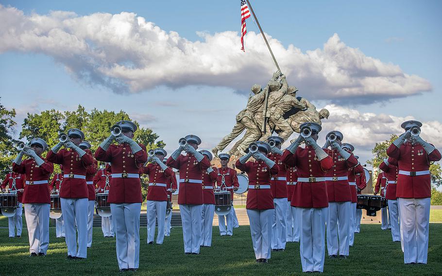 Marines with “The Commandant’s Own” U.S. Marine Drum & Bugle Corps perform “music in motion” during a Tuesday Sunset Parade at the Marine Corps War Memorial, Arlington, Va., July 25, 2017.