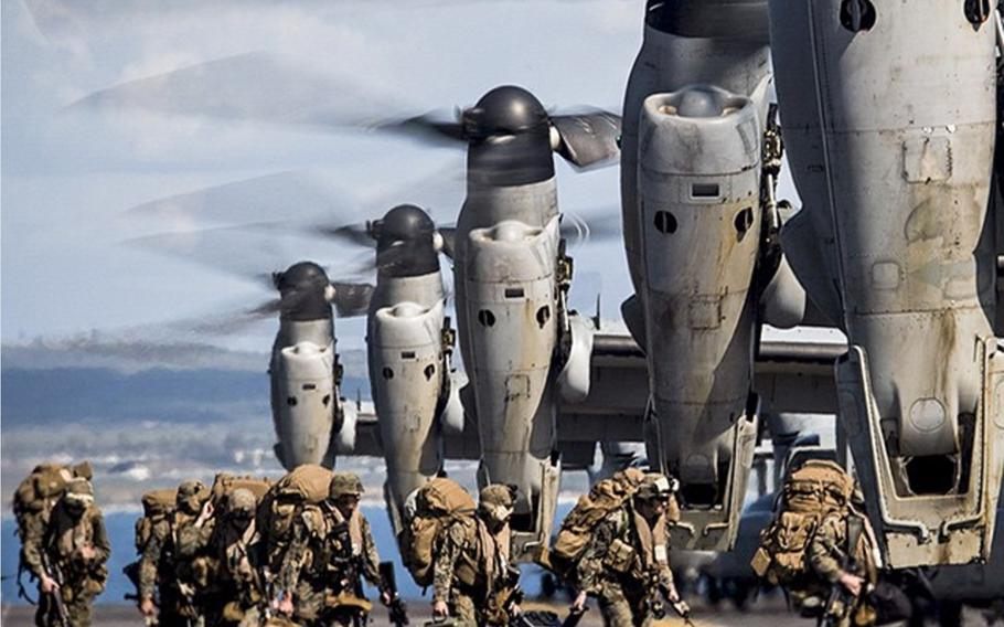 Marines prepare to board MV-22 Ospreys on the flight deck of the amphibious assault ship USS Makin Island off the coast of Camp Pendleton, Calif., on Feb. 23, 2015. The Marine Corps announced Friday, Aug. 11, 2017, that all its aviation units must cease flying for a 24-hour period within the next two weeks to review safety procedures, following two recent crashes that killed 19 servicemembers.