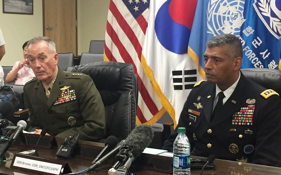Gen. Joseph Dunford, left, chairman of the Joint Chiefs of Staff, and Gen. Vincent Brooks, commander of U.S. Forces Korea, speak at a press conference, Monday, Aug. 14, 2017, in Seoul, South Korea.