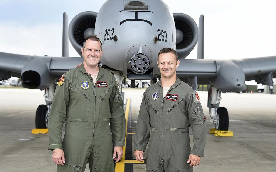 Capt. Brett DeVries (right) and his wingman Maj. Shannon Vickers, both A-10 Thunderbolt II pilots of the 107th Fighter Squadron from Selfridge Air National Guard Base, Mich. Vickers helped DeVries safely make an emergency landing July 20, 2017.