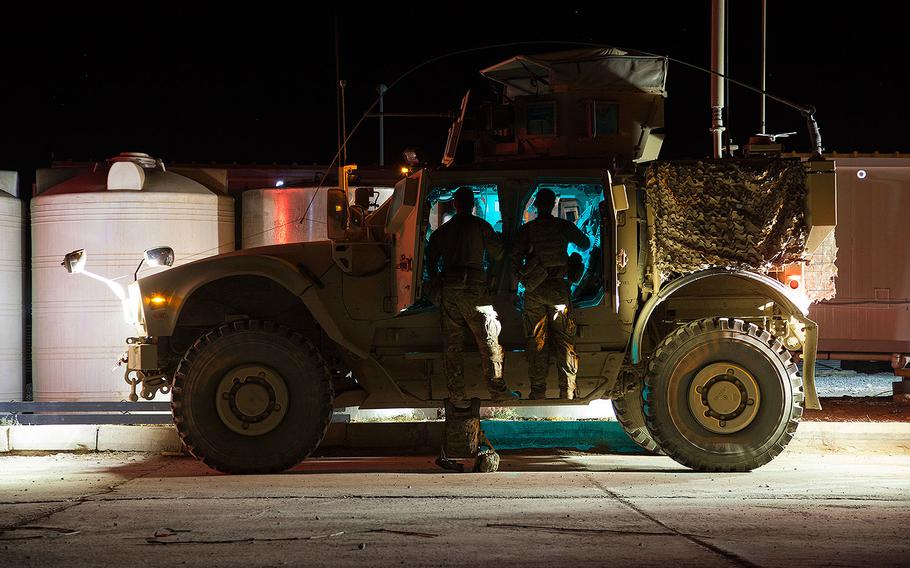 U.S. Army paratroopers, assigned to the 2nd Brigade Combat Team, 82nd Airborne Division, prepare a military armored tactical vehicle for movement in support of their advise and assist mission to Iraqi security forces maneuvering to liberate Tal Afar from ISIS in northern Iraq, Aug. 20, 2017. 