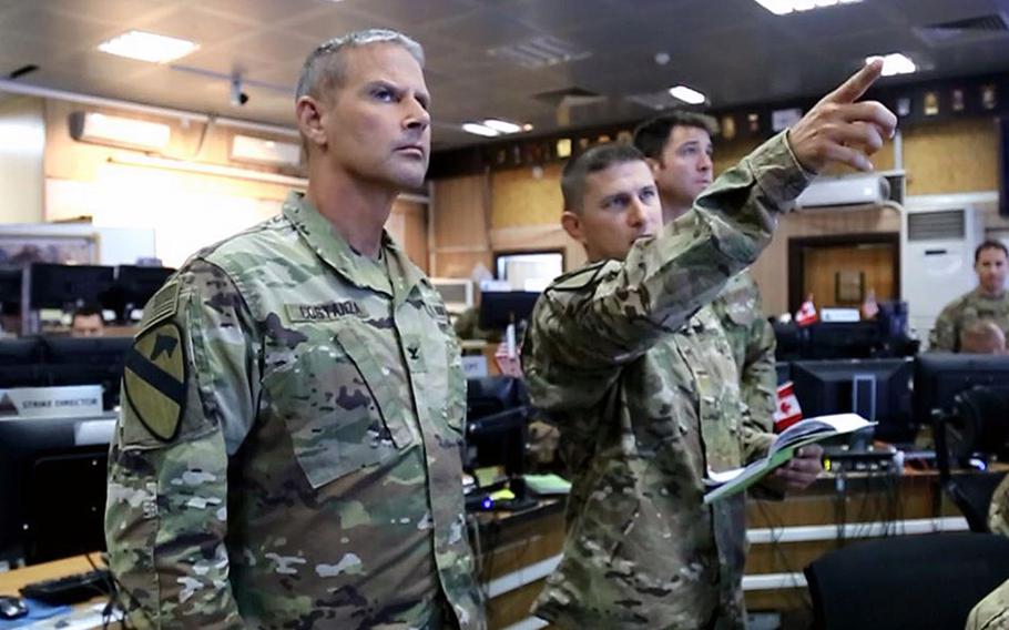 Col. Charlie Costanza, left, a deputy commander with the U.S.-led anti-Islamic State coalition, is pictured here in this video screengrab at a coalition ''strike cell'' inside a combined joint operations center in Irbil, Iraq, during a briefing on a proposed strike against an ISIS target on Tuesday, July 11, 2017.
