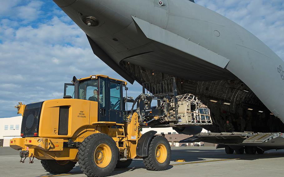 Alaska Air National Guard airmen load and secure cargo onto a Joint Base Elmendorf-Richardson C-17 Globemaster III in Alaska on Aug. 28, 2017. They were traveling to Houston as part of a humanitarian mission in response to Hurricane Harvey.