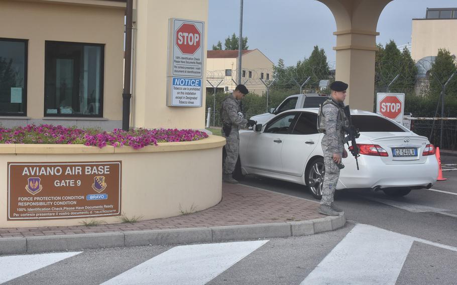 Security personnel check identifications as cars pull into the main gate at Aviano Air Base, Italy, on Aug. 31, 2017. A 25-year-old Moroccan national remains under house arrest after trying to get onto Aviano Air Base in early July by using an ID card bearing the name of an active-duty servicemember.