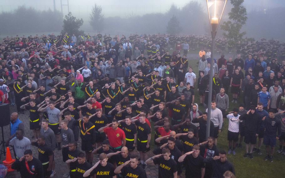 U.S. Army soldiers, family members and civilians who work on base salute the flag before the U.S. Army Garrison Bavaria 9/11 Freedom Run in Grafenwoehr, Germany, Monday, Sept. 11, 2017.

Martin Egnash/Stars and Stripes