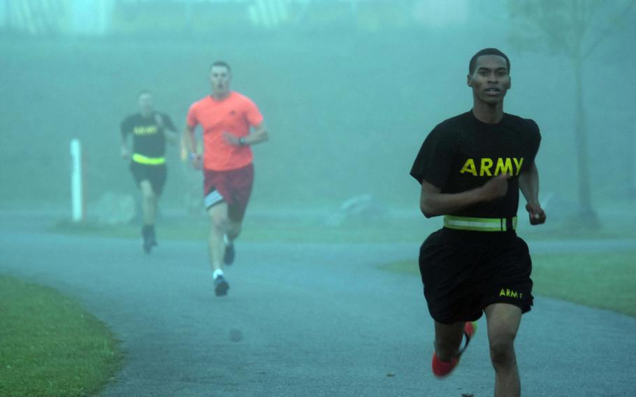 U.S. Army soldiers run through the early morning fog during the U.S. Army Garrison Bavaria 9/11 Freedom Run in Grafenwoehr, Germany, Monday, Sept. 11, 2017.

Martin Egnash/Stars and Stripes