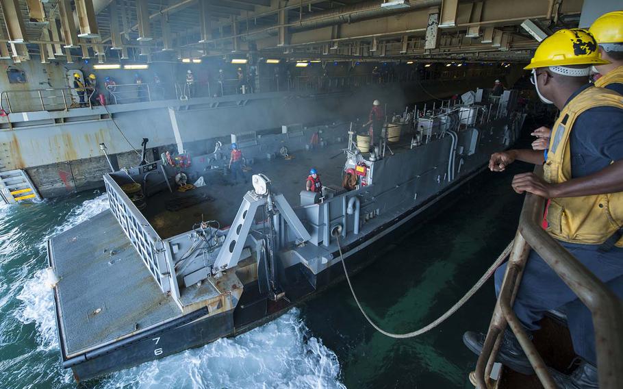 Sailors conduct well deck operations with Landing Craft Unit 1664 aboard the amphibious assault ship USS Wasp on Aug. 31, 2017. The Wasp will delay its deployment to the Pacific as it continues relief operations in Puerto Rico in the aftermath of Hurricane Maria.