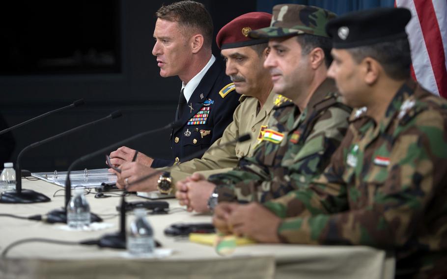 Operation Inherent Resolve spokesman Army Col. Ryan Dillon, left, and spokesmen for the Iraqi security forces brief members of the media on the Liberation of Mosul at the Pentagon, July 13, 2017. On Tuesday, Oct. 17, Dillon noted that clashes on Monday between Iraq's Kurdish forces and government-controlled Iraqi forces distract from the mission to defeat Islamic State.