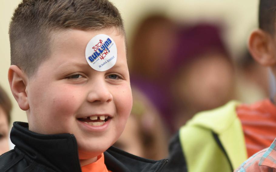 Ryan Daniels, a student at Ramstein Intermediate School in Germany, prominently wears his "Stop Bullying Now" sticker during the school's celebration of Unity Day on Wednesday, Oct. 18, 2017. The school encouraged kids to stand up to bullying while promoting kindness, acceptance and inclusion.
