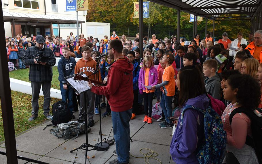Students at Ramstein Intermediate School in Germany joined music teacher Steven Rayburn in singing "Don't Laugh at Me," on Wednesday, Oct. 18, 2017, during the school's celebration of Unity Day. In the song, children who have been teased, among others, ask for acceptance from others.