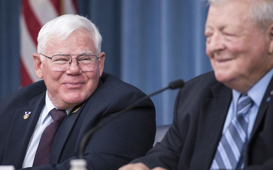 Retired Army Capt. Gary Michael Rose, left, shares a laugh with Retired Army Lt. Col. Eugene McCarley Friday, Oct. 20, 2017 at the Pentagon. Rose will be presented the Medal of Honor on Monday for his actions during a four-day mission into Laos in 1970 as a member of an Army Special Forces team during the Vietnam War. McCarley was the commander for the mission, known as Operation Tailwind.
