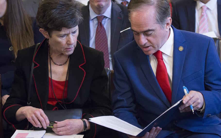 VA Secretary David Shulkin and Veterans Health Administration Executive in Charge Carolyn Clancy go over their notes before a House Veterans' Affairs Committee hearing on Capitol Hill, Oct. 24, 2017.