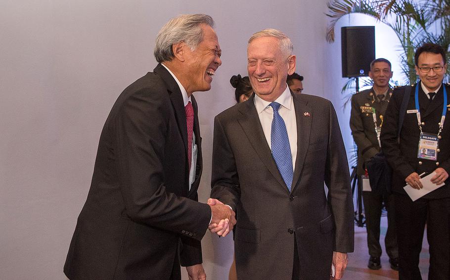 Defense Secretary Jim Mattis shakes hands with Singapore's Minister of Defense Ng Eng Hen following a meeting with the Association of Southeast Asian Nations Defense Ministers (ASEAN) in Clark, Philippines on Oct. 24, 2017. 