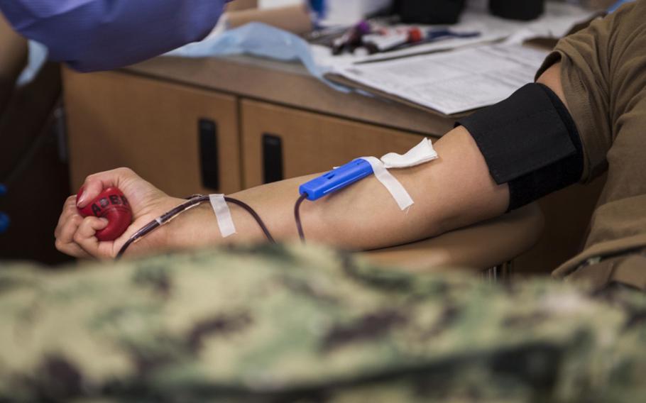 A sailor donates blood during a blood drive on Joint Expeditionary Base Little Creek, Va., on Aug. 29, 2017.