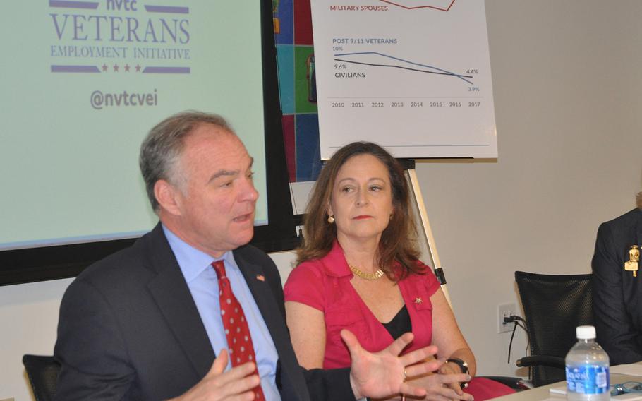 Sen. Tim Kaine, D-Va., left, speaks at a summit on military spouse unemployment on Oct. 23 in Arlington, Va. To his right, Blue Star Families CEO Kathy Roth-Douquet, who spearheaded the event, looks on.