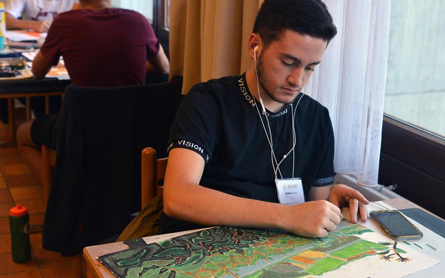 In the oil pastels workshop, Rota's Thomas Pipkin works on his vision of the Rhine River valley and its vineyards at DODEA-Europe's Creative Connections, Wednesday, Nov. 1, 2017.

