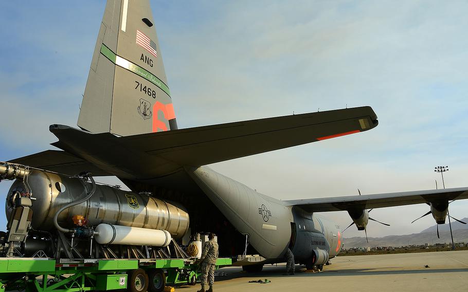 U.S. Air National Guard members load a C-130J aircraft with a MAFFS 2 (Modular Airborne Fire Fighting System) unit at the 146th Airlift Wing located in Port Hueneme, California, Dec. 5, 2017. Aircraft from the 146th Airlift Wing are being prepped for wildfire suppression efforts with CALFIRE to help combat the fires burning in Southern California. 