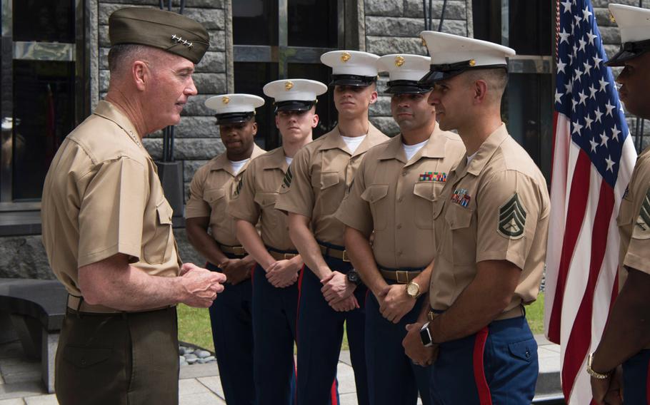 Chairman of the Joint Chiefs of Staff Gen. Joe Dunford speaks with Marines assigned to the Marine Security Guard Battalion at the U.S. Embassy in Singapore, on June 2, 2017. A Defense Department official said Thursday, Dec. 7, that Marine units are ready to protect American embassies and consulates around the world, as the United States' decision to recognize Jerusalem as the capital of Israel is expected to stir unrest.