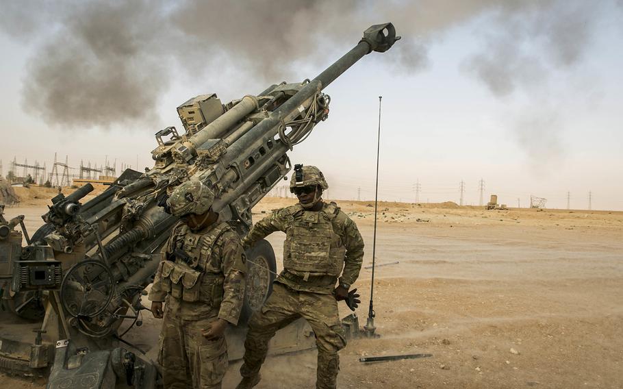 U.S. Army artillery soldiers respond to a fire mission in support of Operation Inherent Resolve in Iraq on Nov. 6, 2017. Some lawmakers in Washington are looking to revise the president’s authority to use military force. 