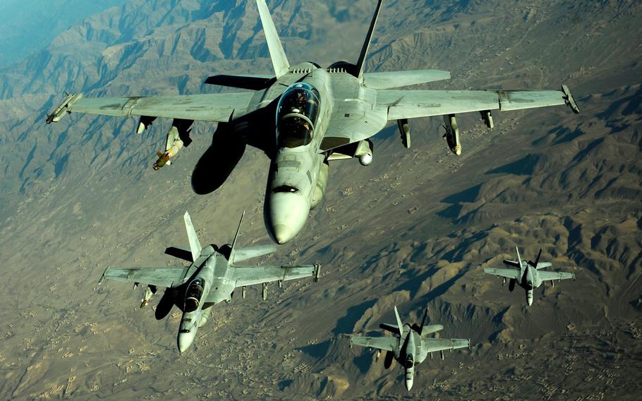 Four U.S. Navy F/A-18 Hornet aircraft fly over mountains in Afghanistan on Nov. 25, 2010. According to a report Thursday, Dec. 14, 2017, a team of NASA investigators recently reported that the Navy missed a series of key factors in its investigation into the causes behind a rash of midair, oxygen-related failures in F/A-18s.