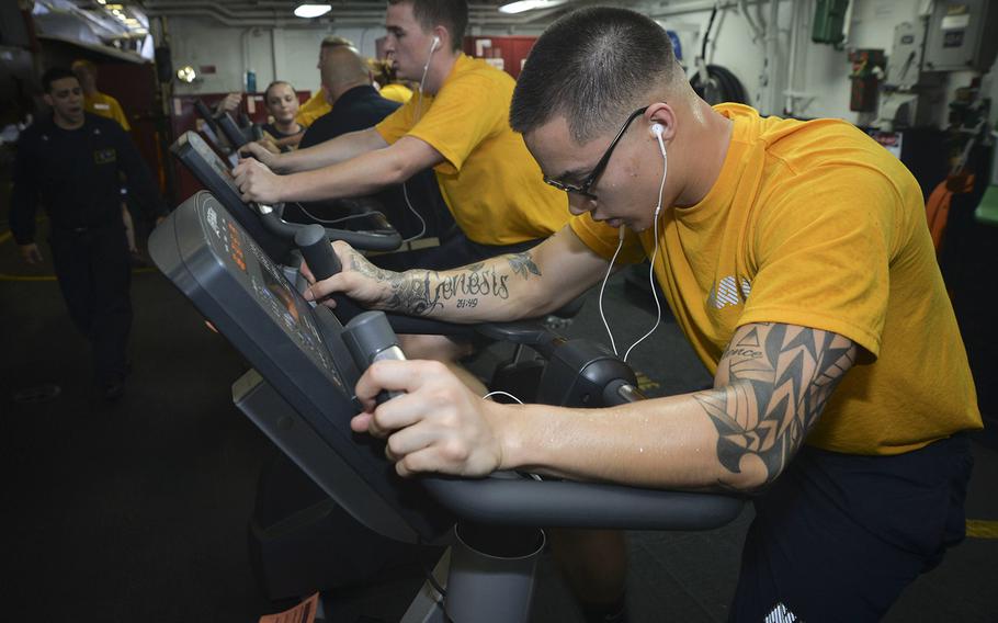 Sailors participate in a physical fitness assessment aboard the aircraft carrier USS Nimitz, June 16, 2017, in the Pacific Ocean.